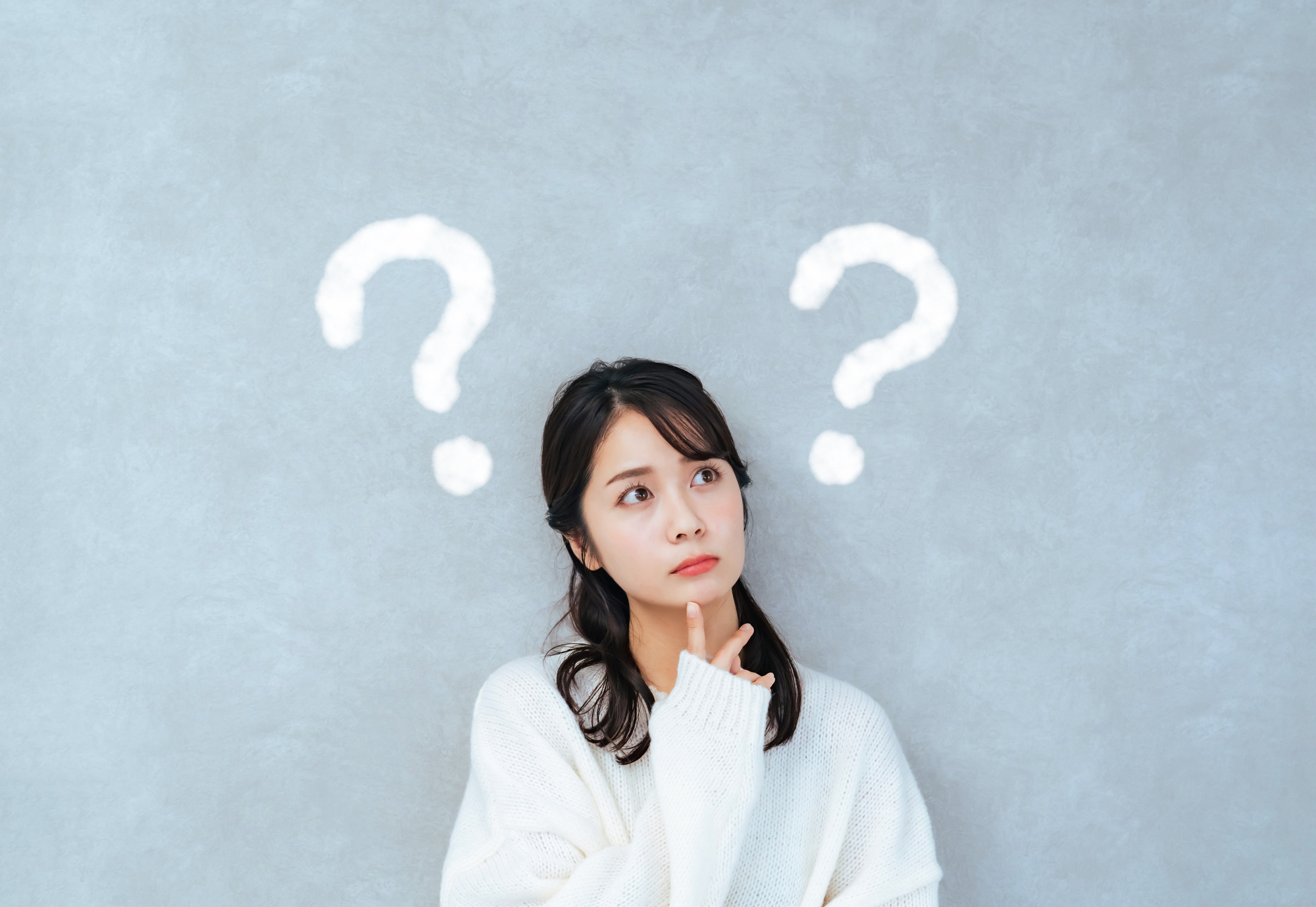 疑問を持つ女性