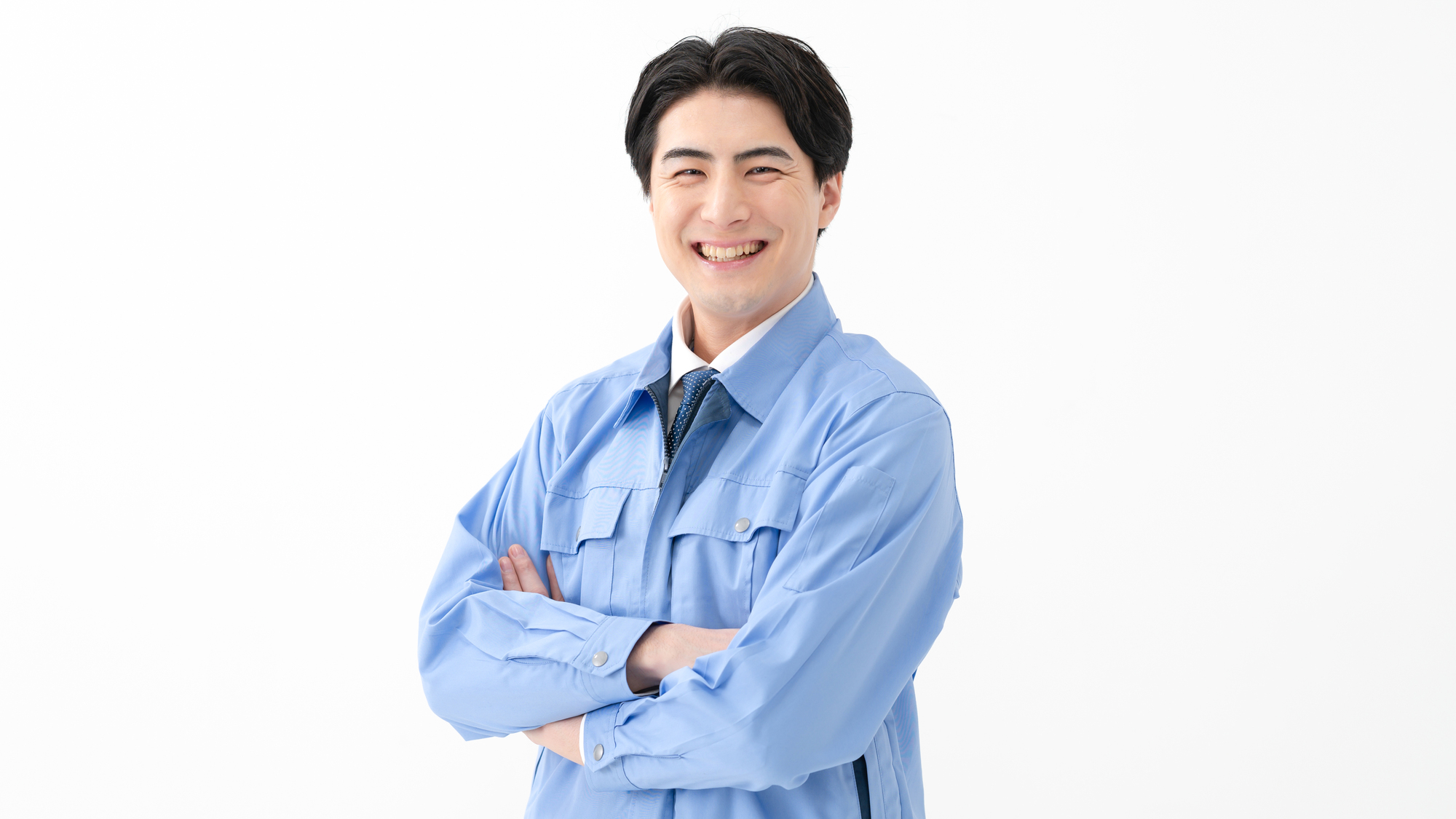 作業着を着て笑顔の男性